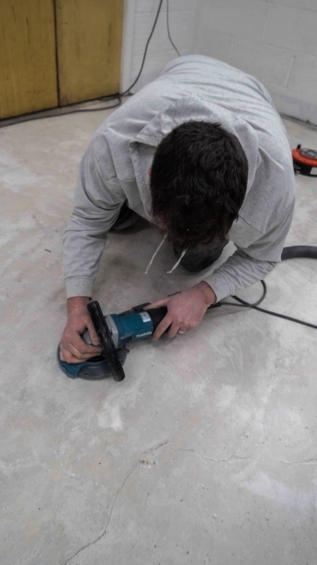 Detail hand-grinding around obstacles.