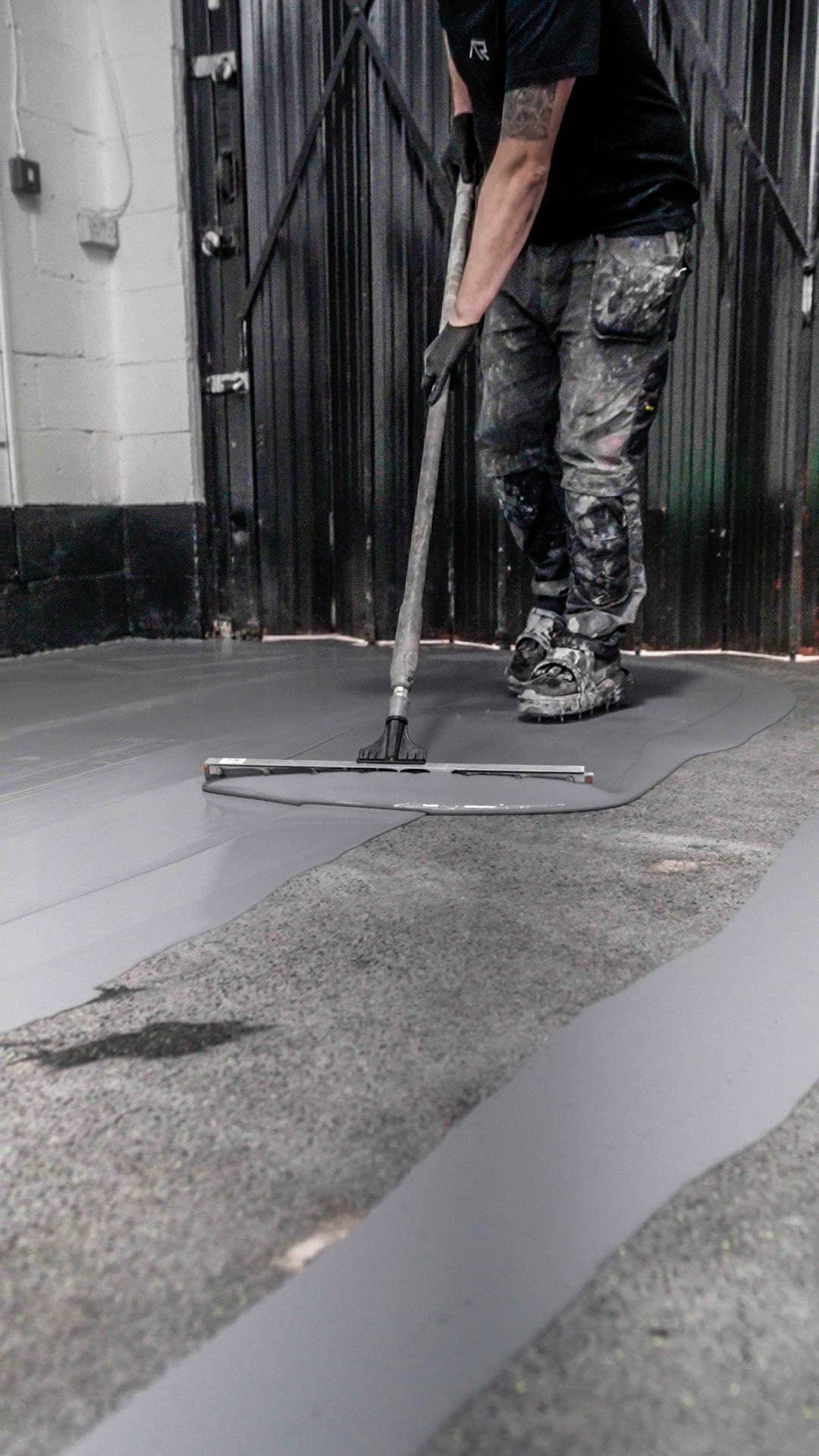 Squeegee epoxy application on commercial floor.