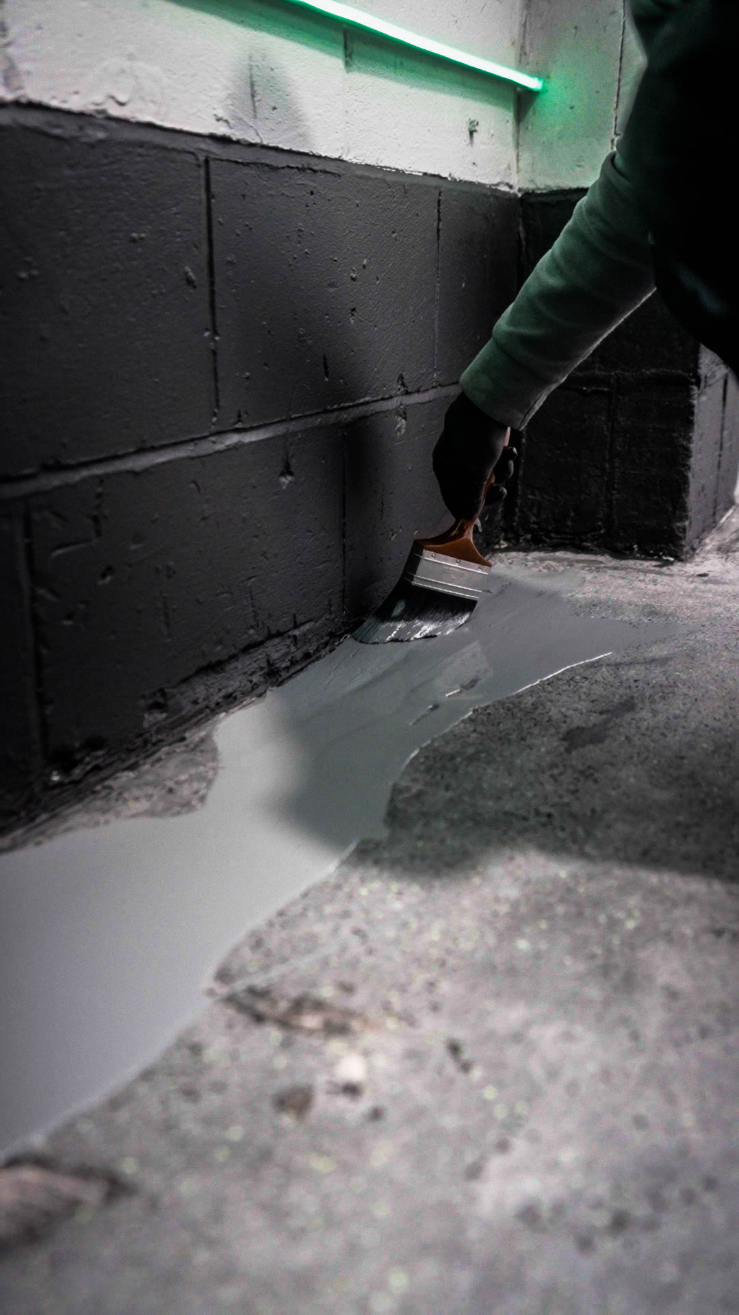 precision edge cutting of resin floor coating at wall junction with detail tool
