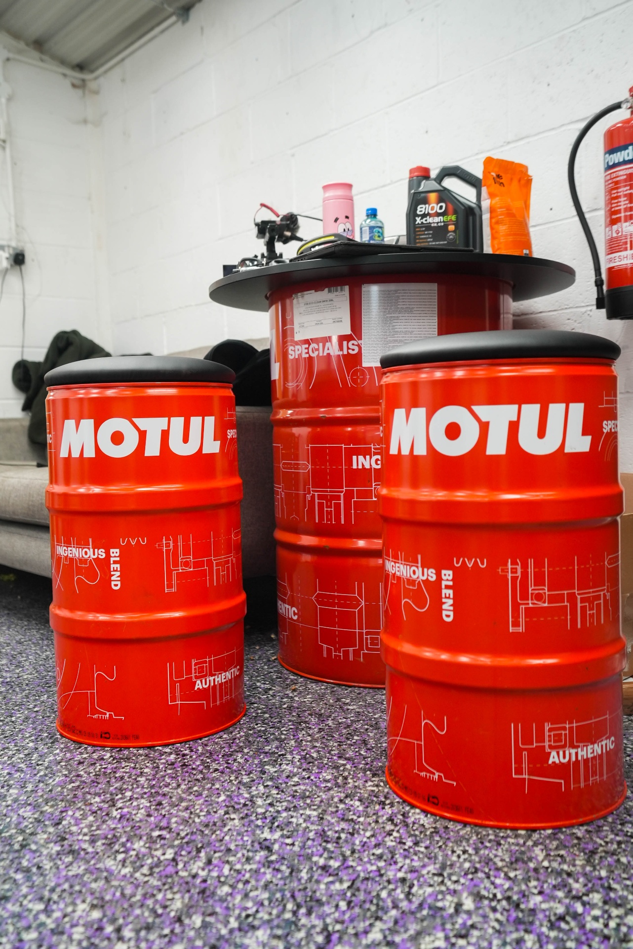 Auto Flake resin floor in professional Motul-branded automotive workshop