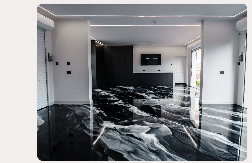 black metallic marble effect resin floor by AutoResin in modern open-plan living space with LED ceiling lights